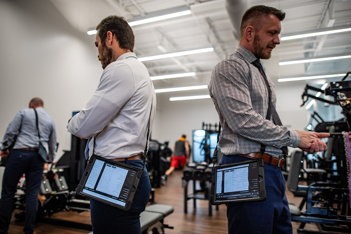 Personal trainers working with clients while using StrengthPortal