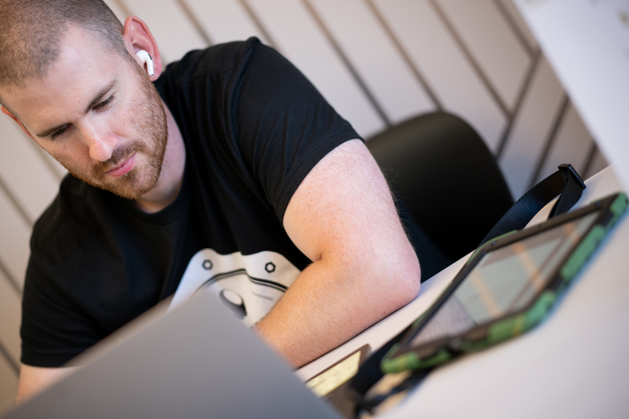 A personal trainer working with a client online using StrengthPortal